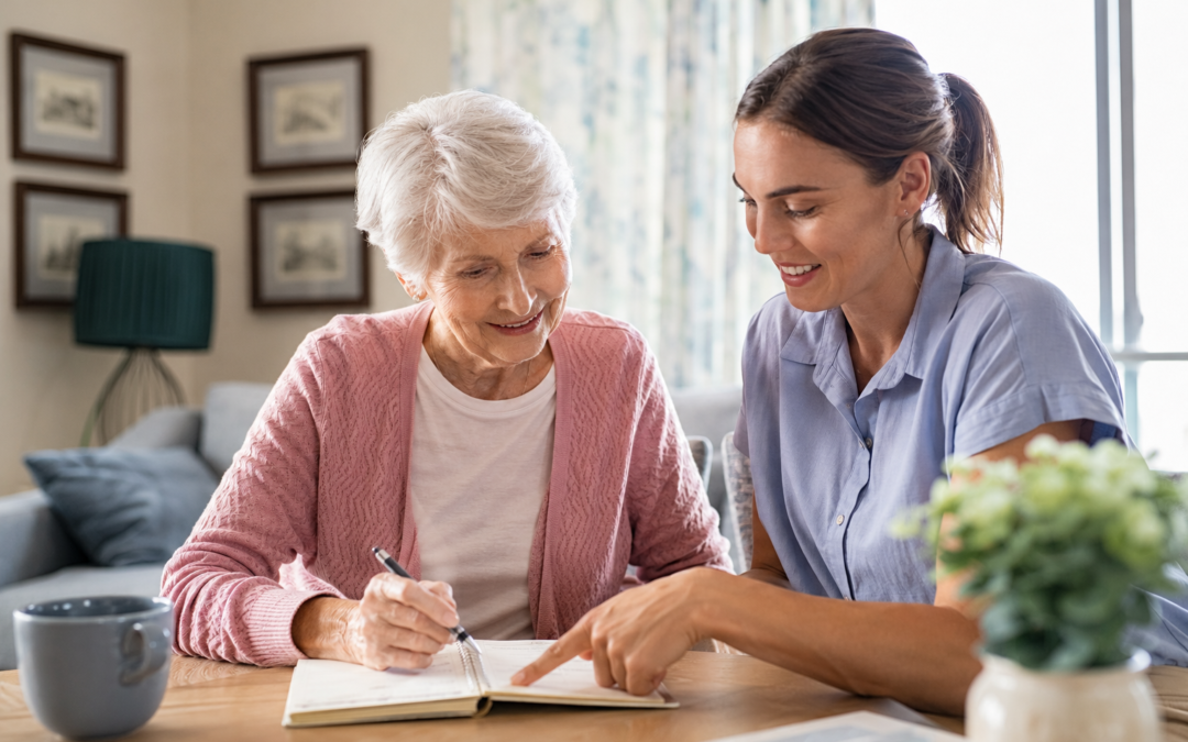 Senior care planning with an older woman and caregiver reviewing her care routine at home